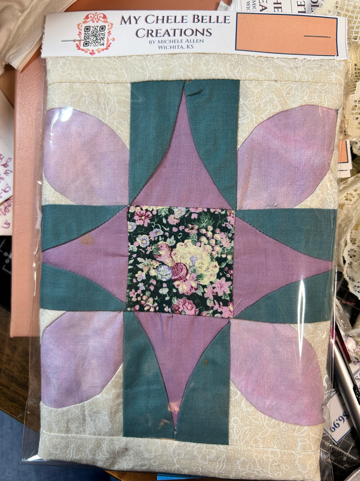 4 floral quilt blocks in purple & teal