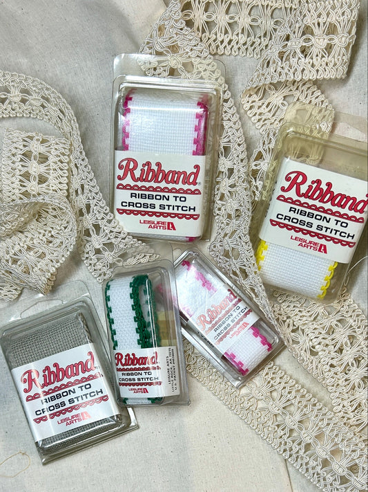 Packaged ribbon for cross stitch on a lace background